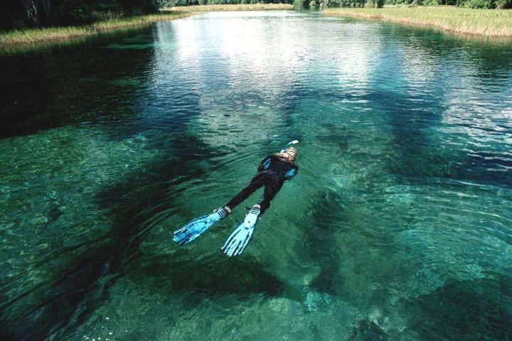 a man riding a wave on top of a body of water